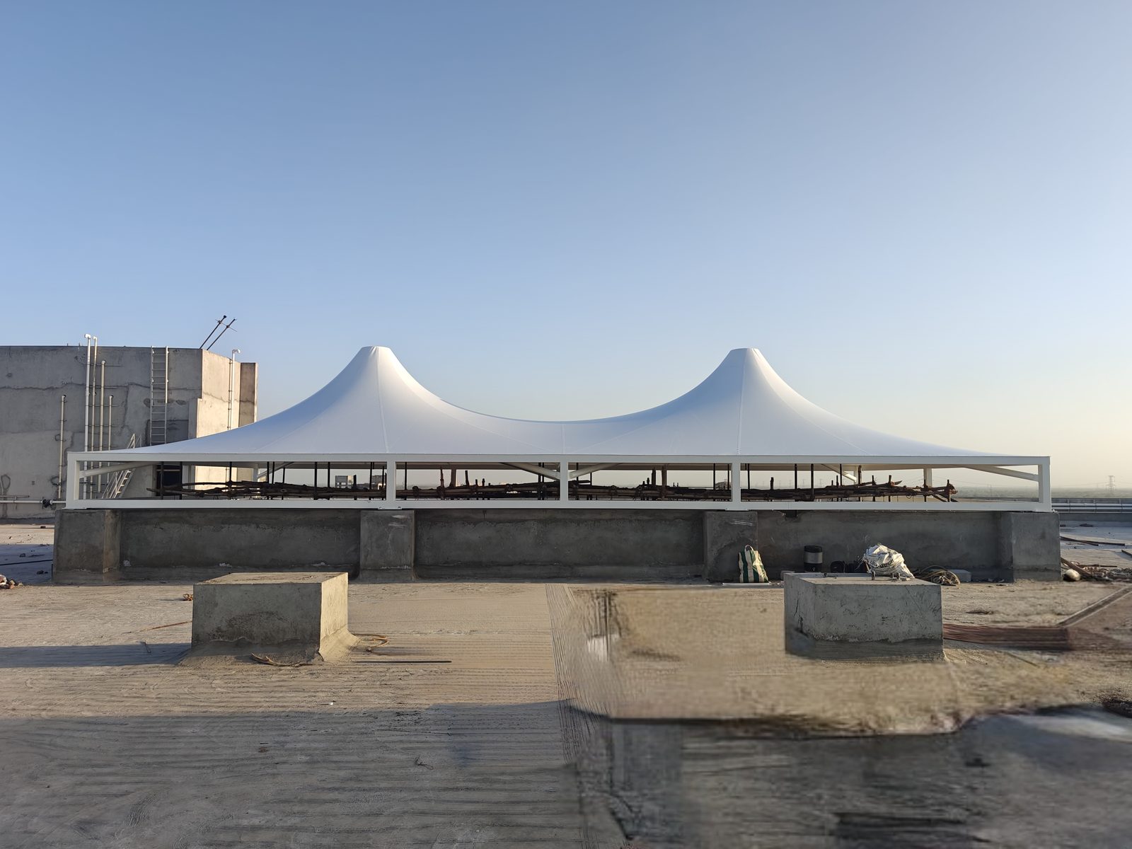 Twin-cone rooftop structure during installation