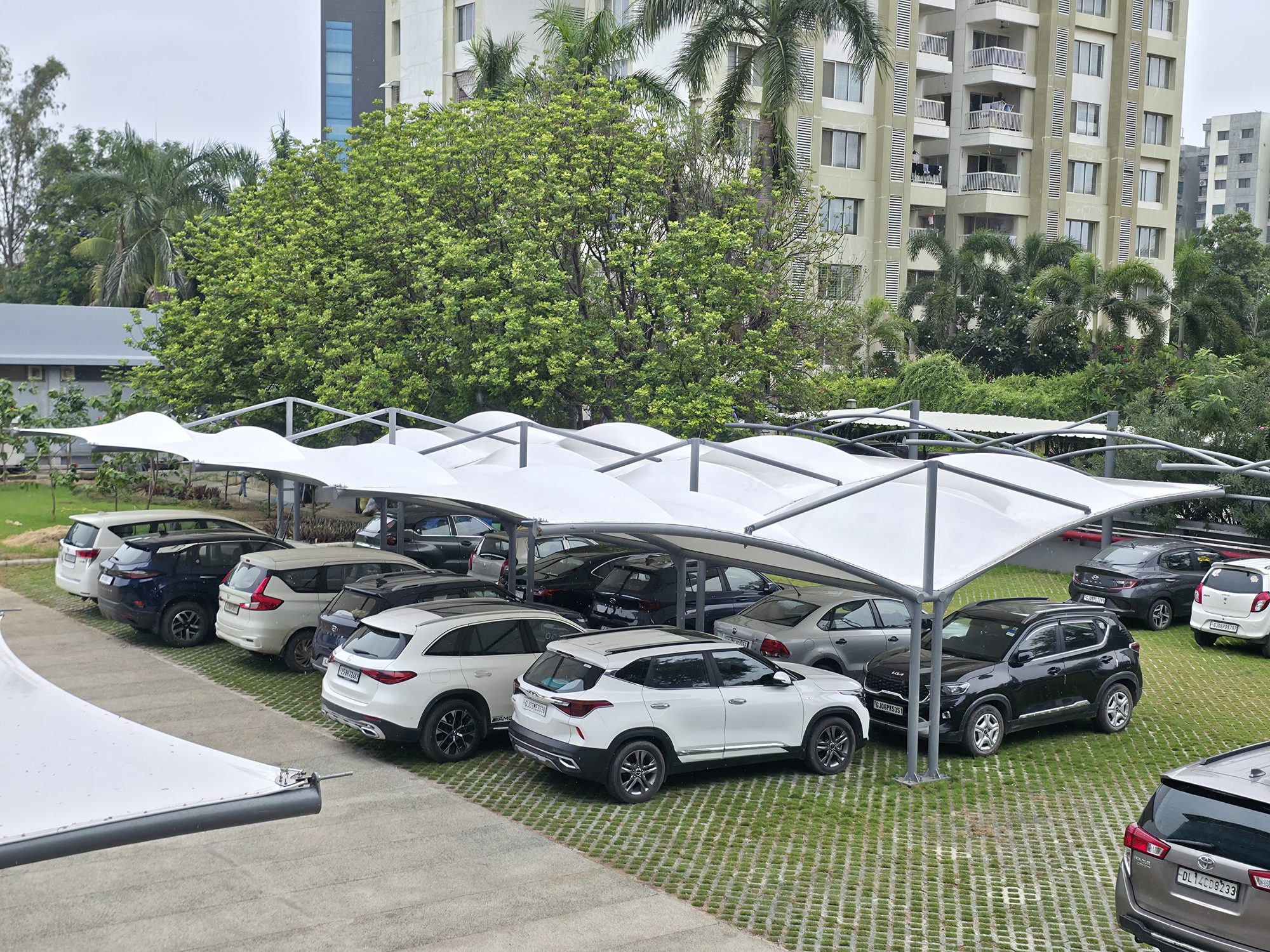 Cantilever parking canopy with residential towers in the background