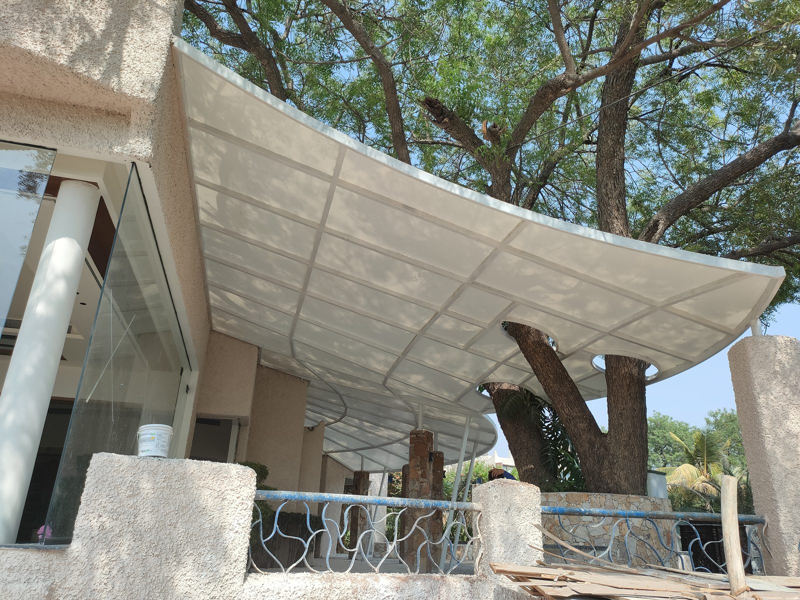 Tensile canopy over a residential balcony