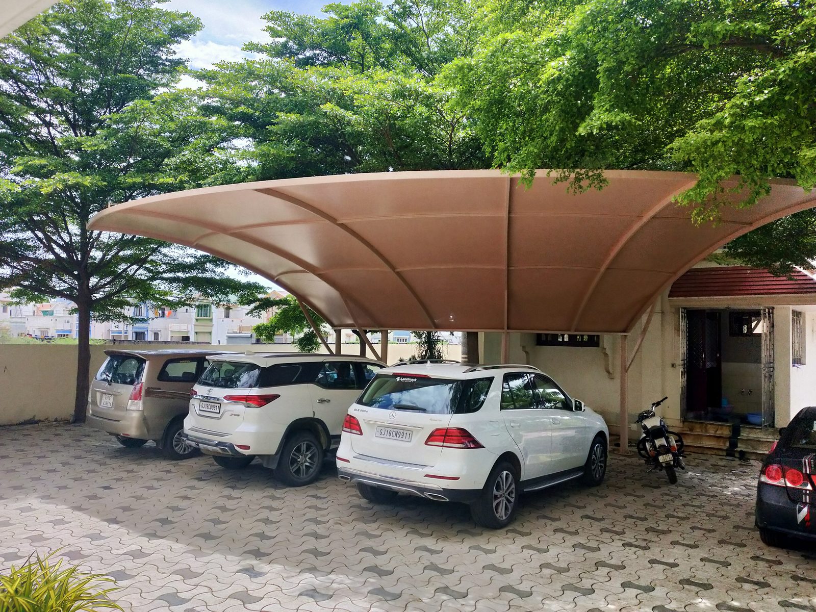 Cantilever parking canopy installations
