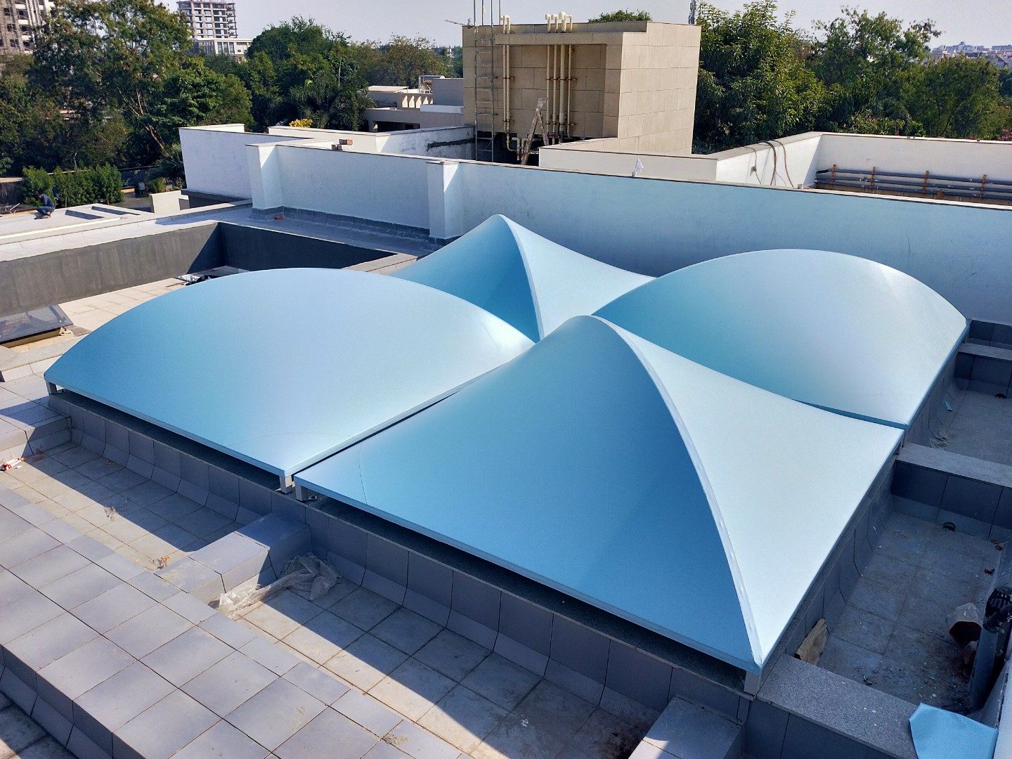 Twin tensile cone rooftop structure